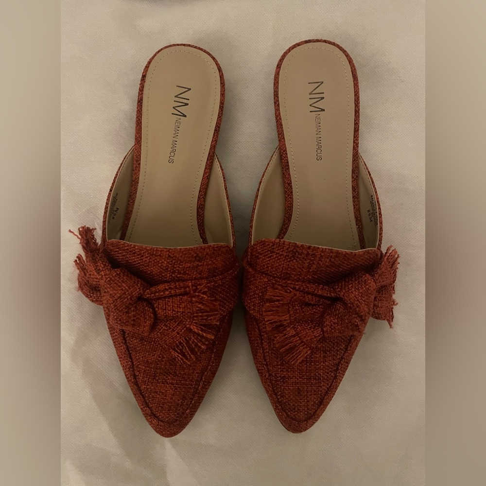 Red pointed toe flats with statement bow detail